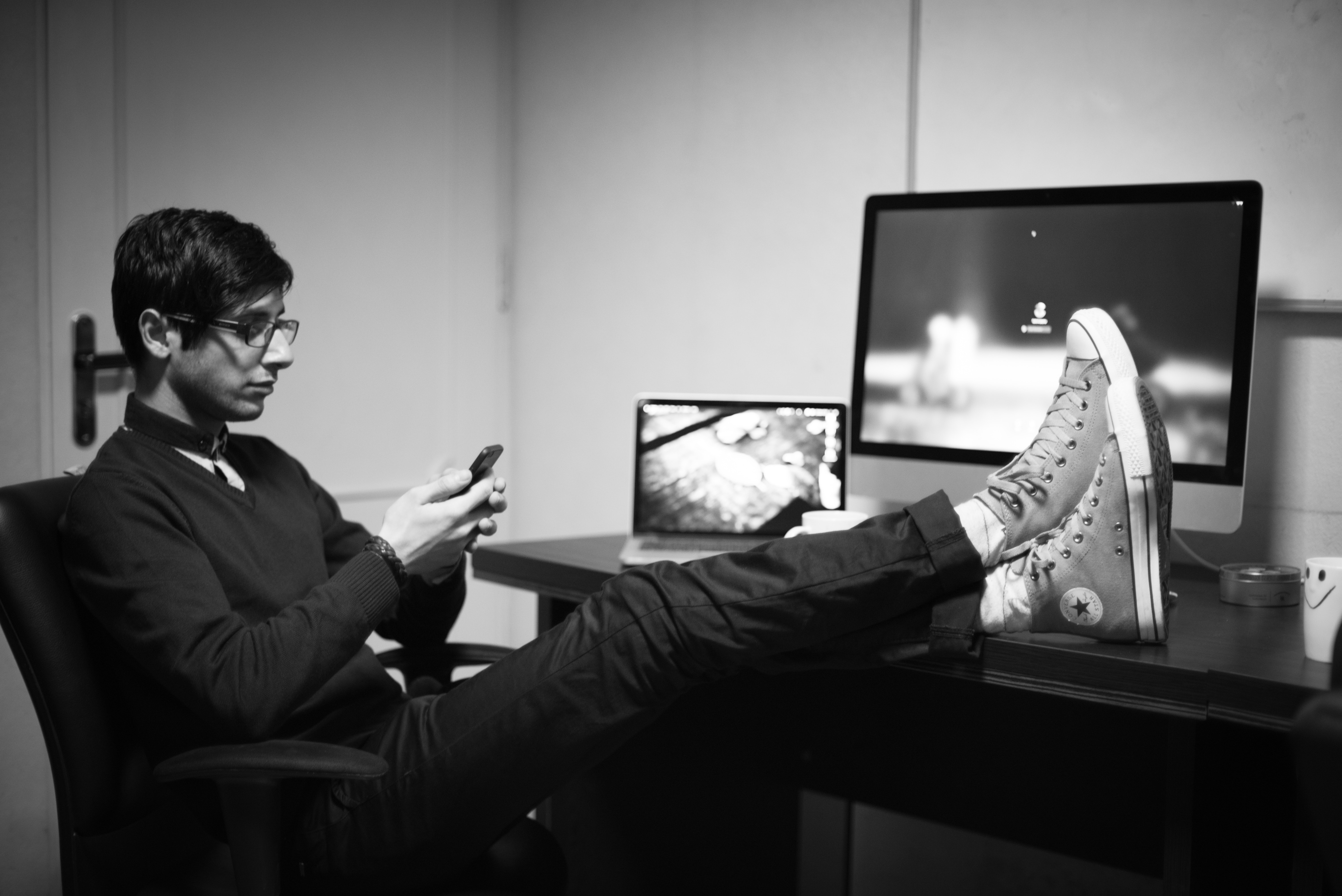 photo of feet on desk